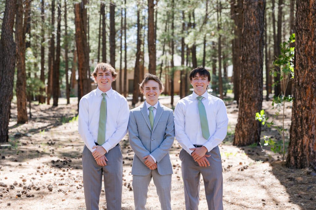 Groomsmen in the forest at Serendipity venue in Flagstaff.
