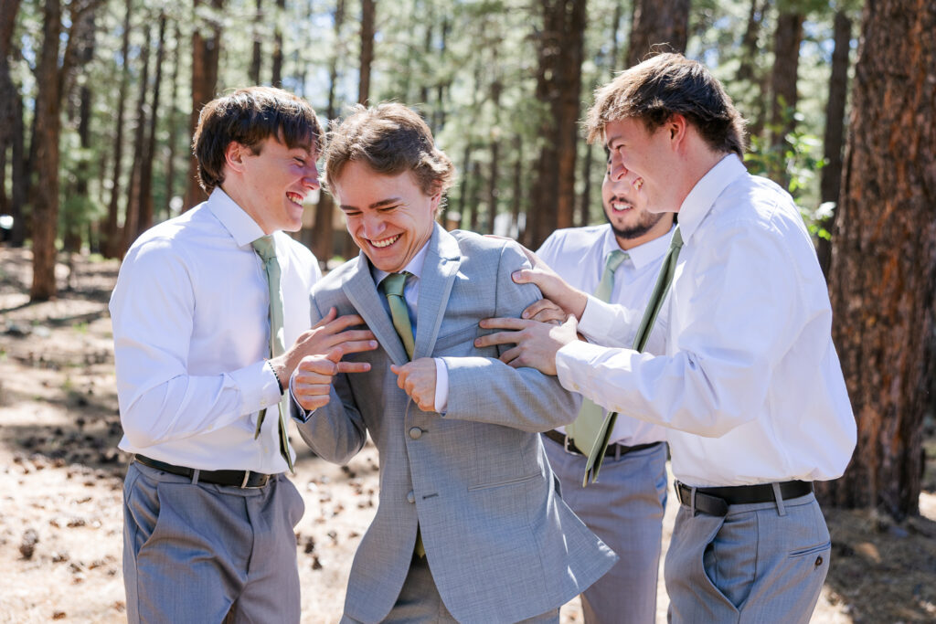 Groomsmen in the forest at Serendipity venue in Flagstaff.