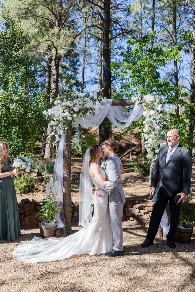 Bride and Groom kiss at the alter after being announced husband and wife. 