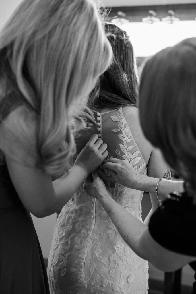 bride getting in dress at the Serendipity bridal suite. 