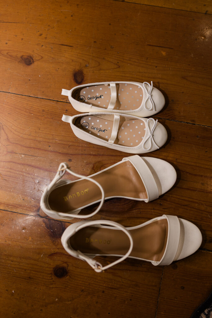 bride and her daughters shoes on the floor of the bridal suite at Serendipity venue in Flagstaff.